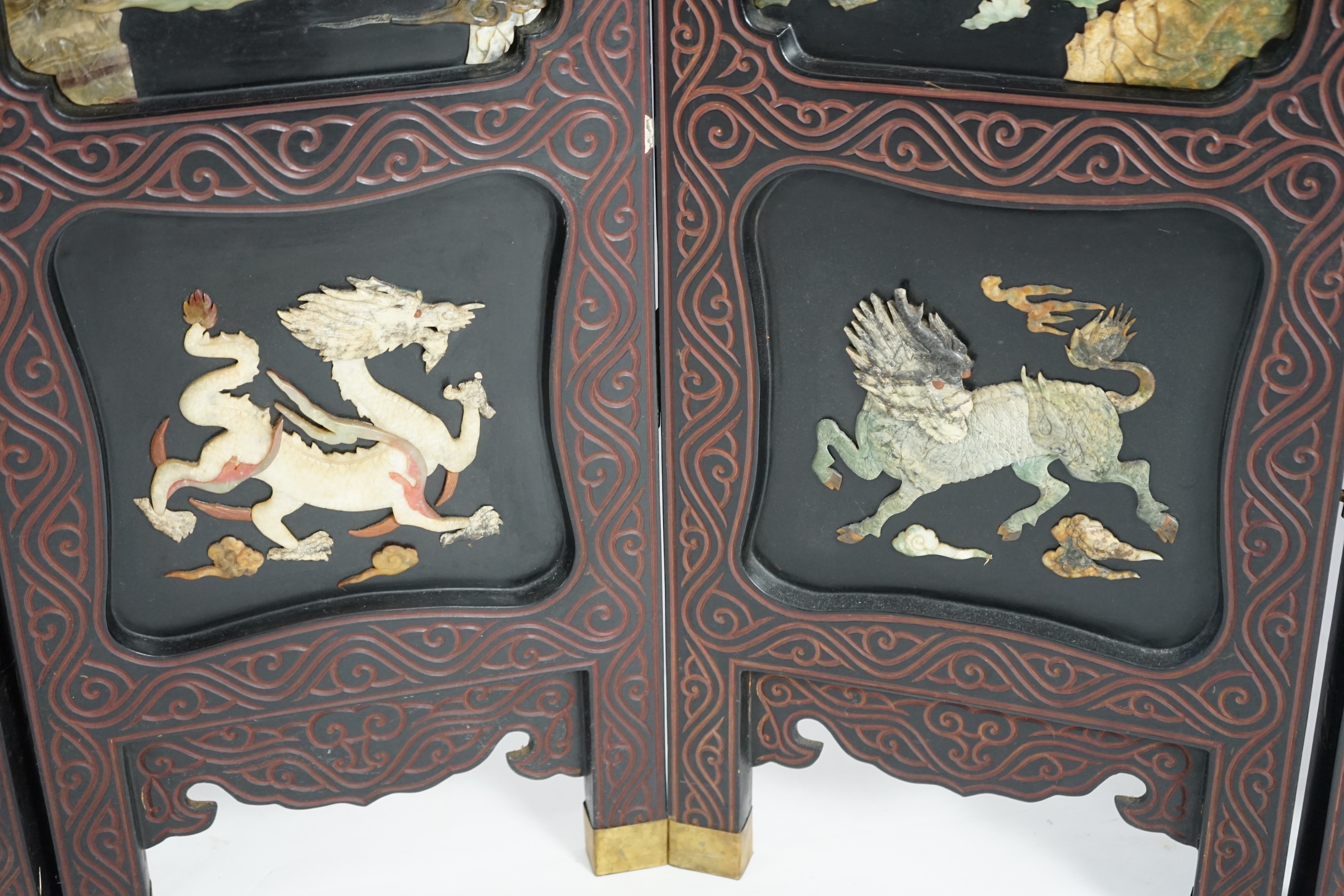 A Chinese tixi lacquer and carved soapstone overlaid six panel screen, mid 20th century